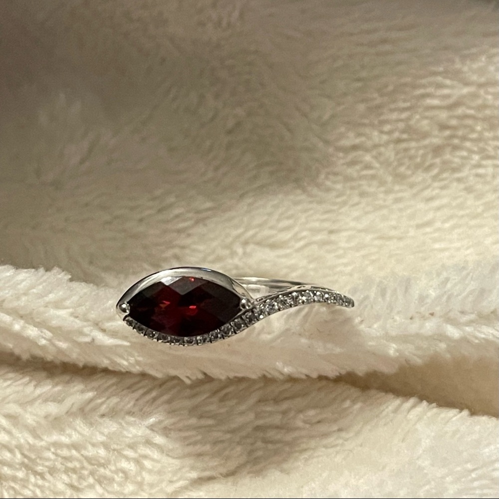 Sterling silver garnet ring. About size 8